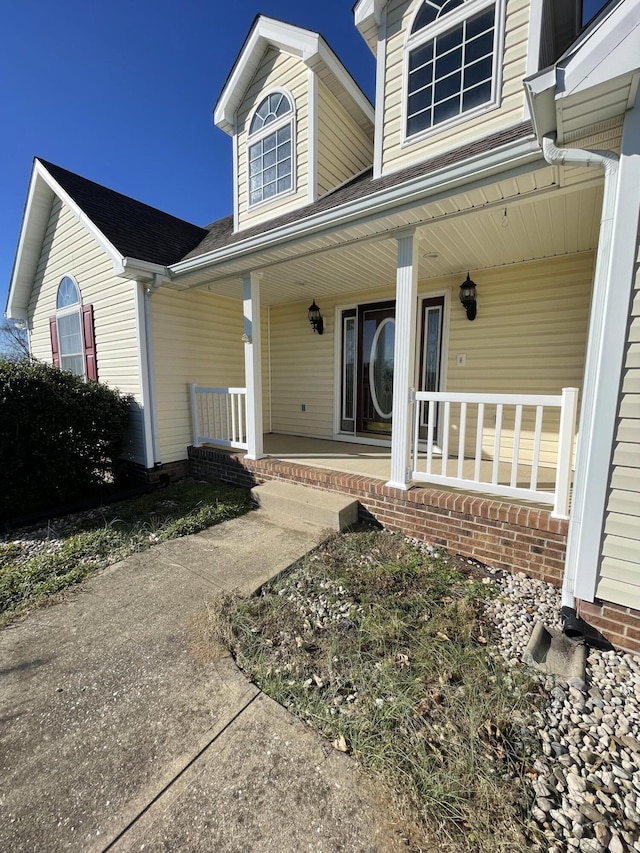 property entrance featuring a porch