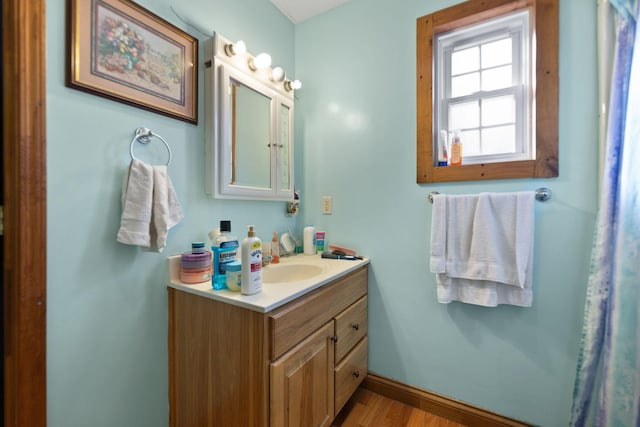 bathroom featuring hardwood / wood-style floors and vanity