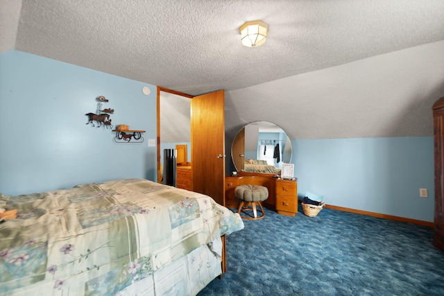 carpeted bedroom featuring a textured ceiling and vaulted ceiling