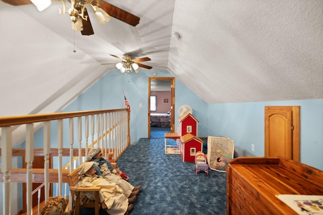 game room featuring ceiling fan, carpet floors, a textured ceiling, and lofted ceiling