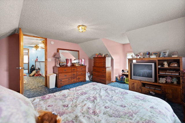 carpeted bedroom with a textured ceiling and lofted ceiling