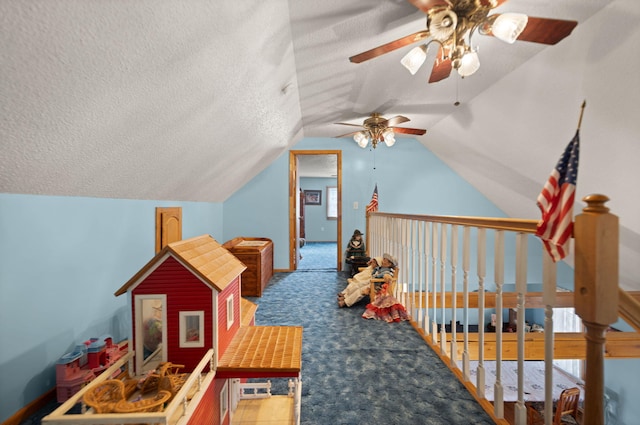 playroom featuring a textured ceiling, ceiling fan, light carpet, and lofted ceiling