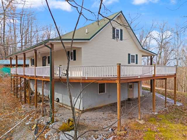 rear view of house featuring a deck