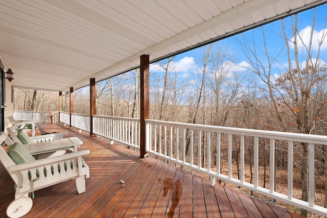 wooden terrace with a porch