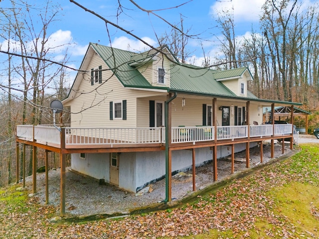 back of house with a wooden deck