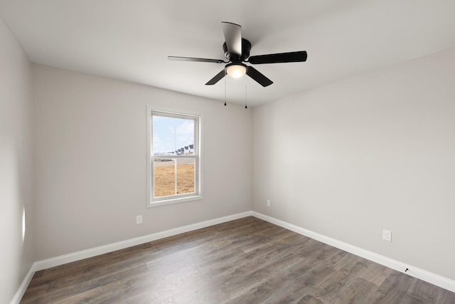 unfurnished room with ceiling fan, baseboards, and wood finished floors