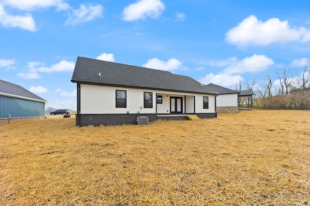 back of property with cooling unit and french doors