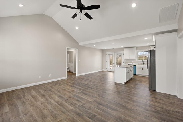 kitchen featuring ceiling fan, white cabinetry, stainless steel appliances, a center island, and french doors