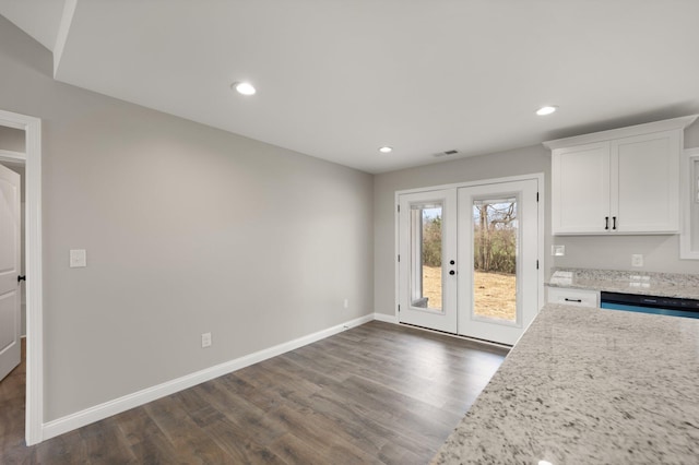 interior space with baseboards, visible vents, dark wood finished floors, french doors, and recessed lighting