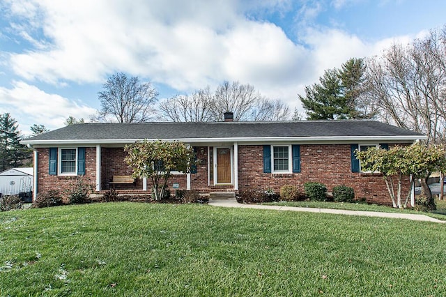 ranch-style house featuring a front lawn