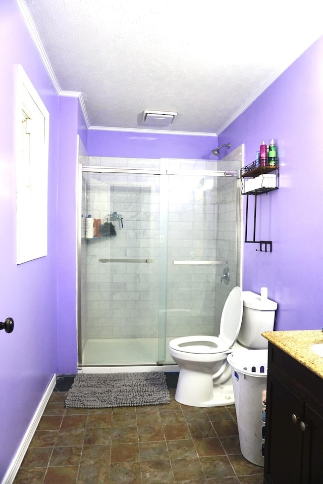 bathroom featuring walk in shower, crown molding, a textured ceiling, toilet, and vanity