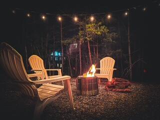 patio at twilight with an outdoor fire pit