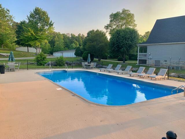 view of swimming pool with a patio area