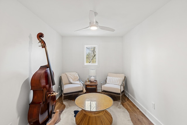 living area featuring ceiling fan and light wood-type flooring