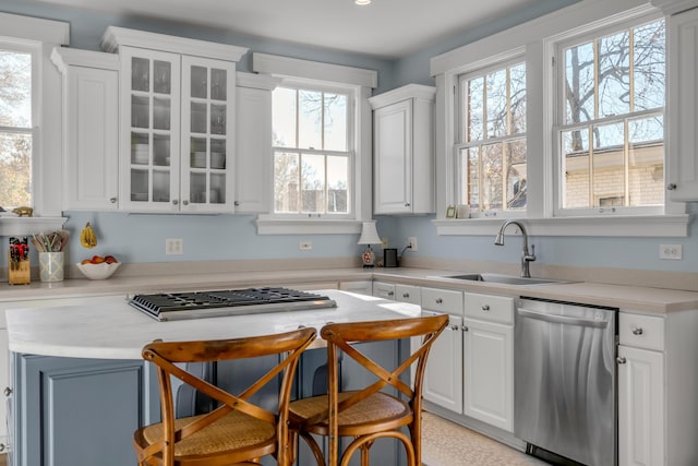 kitchen featuring white cabinetry, sink, plenty of natural light, and appliances with stainless steel finishes