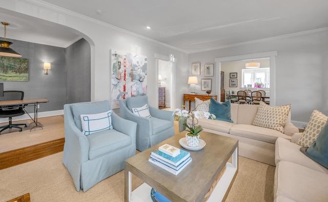 living room featuring crown molding and light hardwood / wood-style flooring