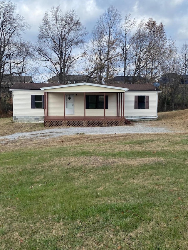 ranch-style house with a porch and a front yard