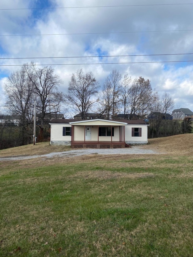 view of front of property with a front yard and a porch