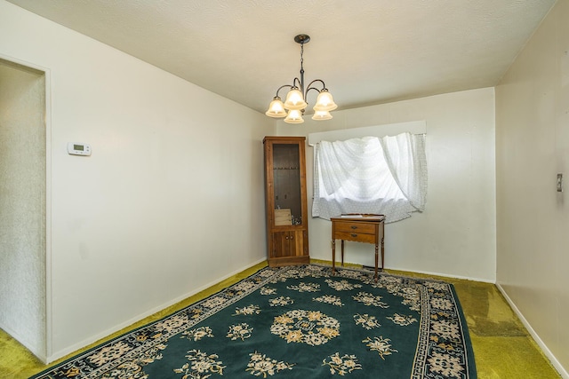 carpeted dining area with a textured ceiling and an inviting chandelier