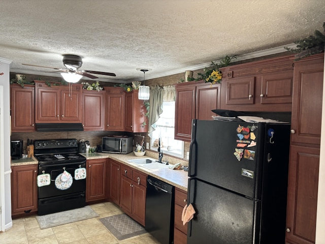 kitchen with a textured ceiling, black appliances, sink, hanging light fixtures, and ceiling fan