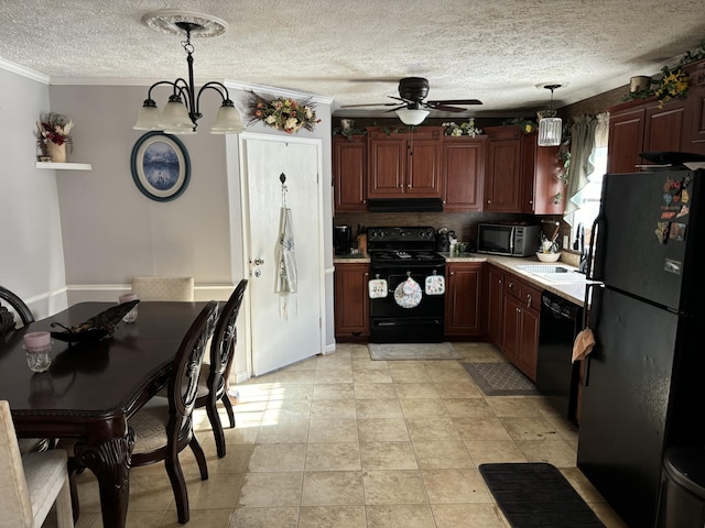 kitchen with pendant lighting, a textured ceiling, crown molding, ceiling fan with notable chandelier, and black appliances