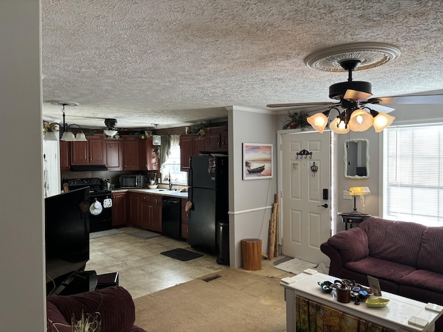 living room featuring ceiling fan, sink, and crown molding