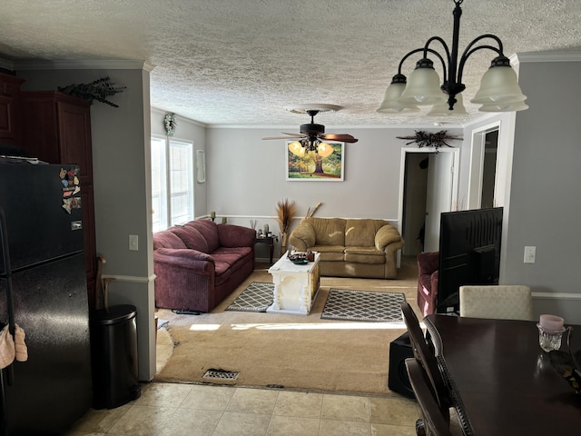 living room with ceiling fan with notable chandelier, a textured ceiling, and ornamental molding