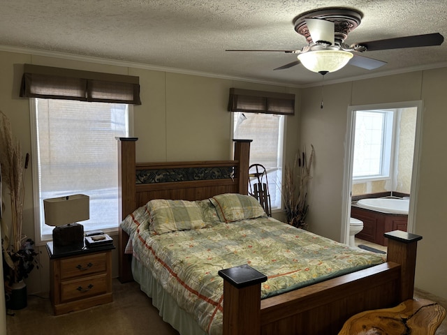 carpeted bedroom with a textured ceiling, ceiling fan, and crown molding