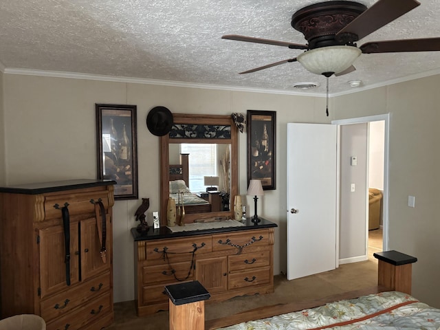 bedroom featuring ceiling fan, dark carpet, a textured ceiling, and ornamental molding