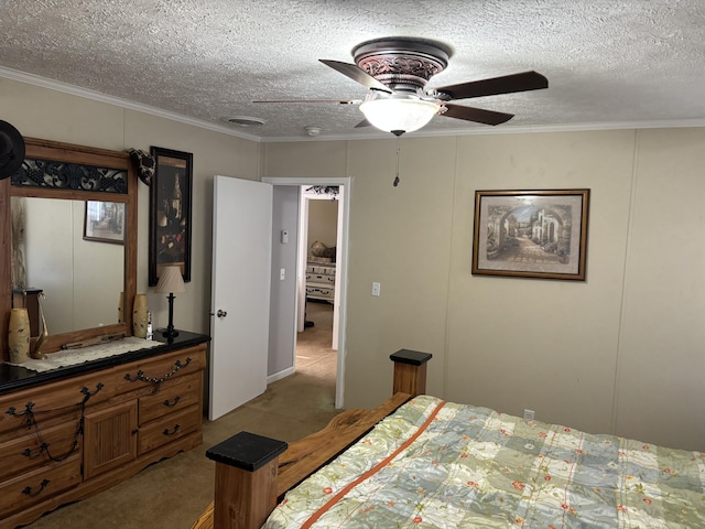 bedroom featuring a textured ceiling, ceiling fan, crown molding, and light colored carpet