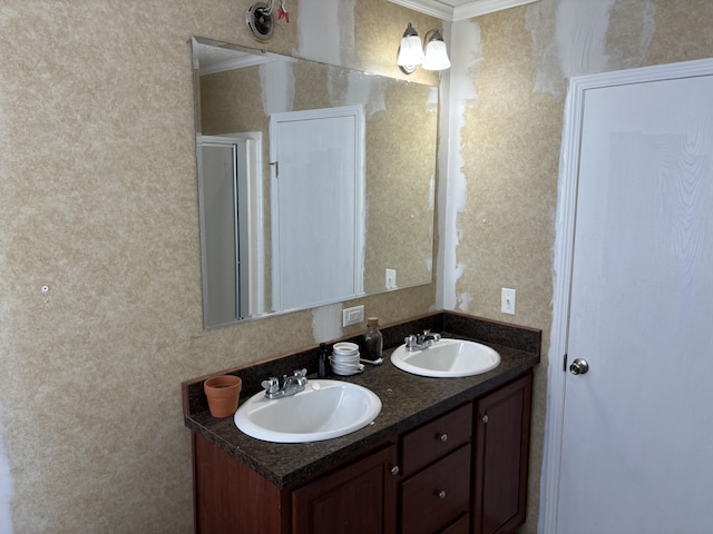 bathroom featuring vanity and ornamental molding