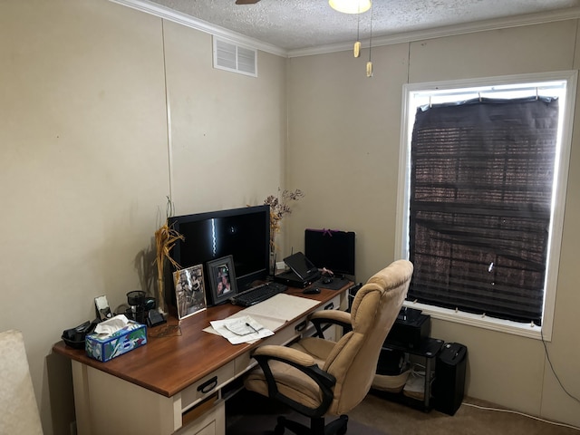 office space with a textured ceiling, ceiling fan, crown molding, and carpet floors