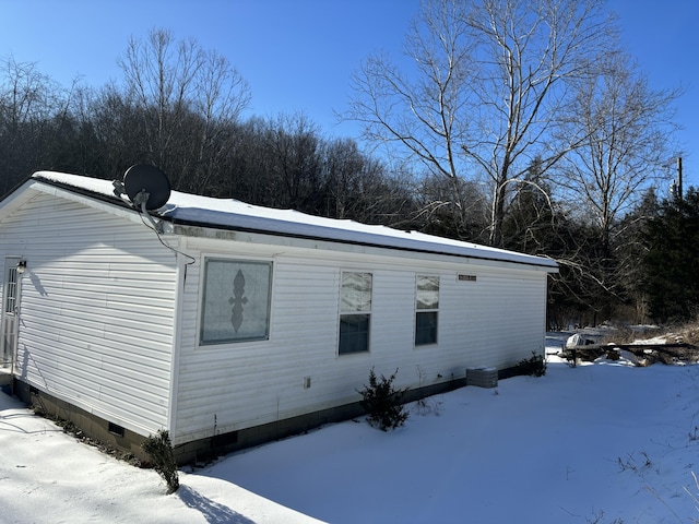 view of snow covered property