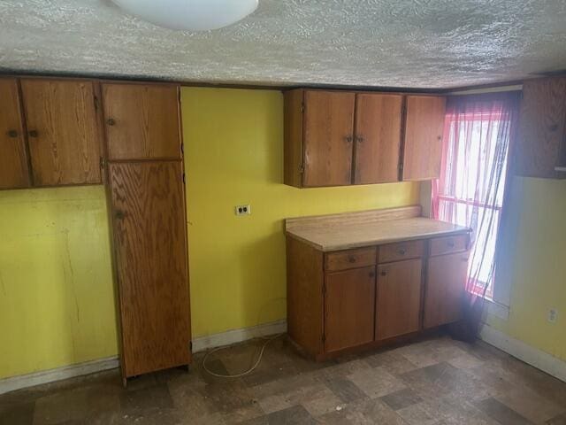 kitchen featuring plenty of natural light and a textured ceiling