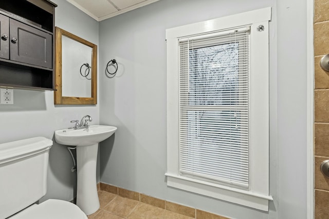 bathroom with tile patterned flooring and toilet