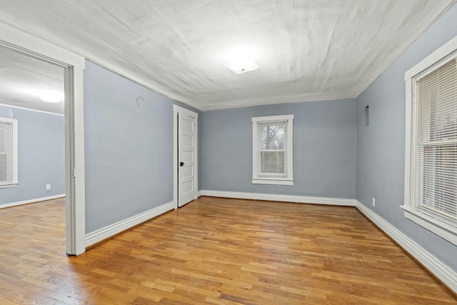 spare room with light hardwood / wood-style floors