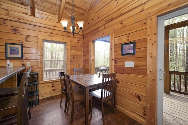 559 Eagle Ridge Rd, Campton, KY 41301 - dining room featuring a chandelier, wooden walls, dark wood-style flooring, and lofted ceiling