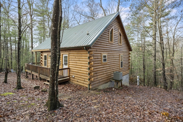 view of home's exterior with central air condition unit and a wooden deck