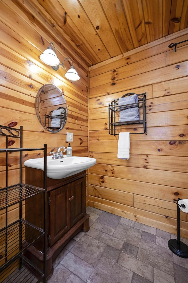 559 Eagle Ridge Rd, Campton, KY 41301 - bathroom featuring vanity, stone tile flooring, wood walls, and wood ceiling