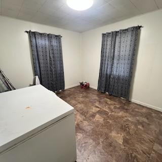 bedroom featuring baseboards