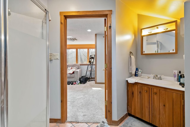 bathroom with tile patterned flooring and vanity