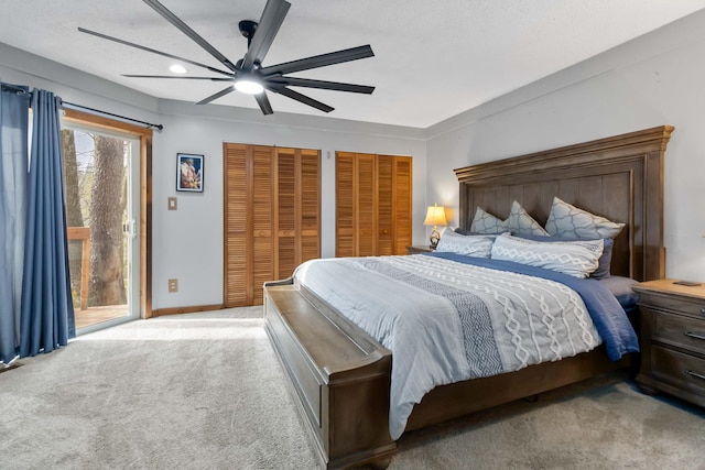 bedroom featuring multiple closets, ceiling fan, light colored carpet, and access to exterior