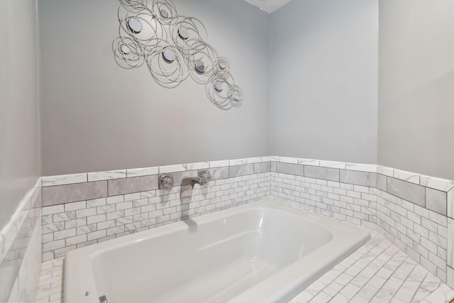 bathroom featuring tiled bath