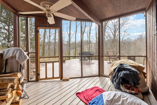 sunroom / solarium with ceiling fan and wood ceiling