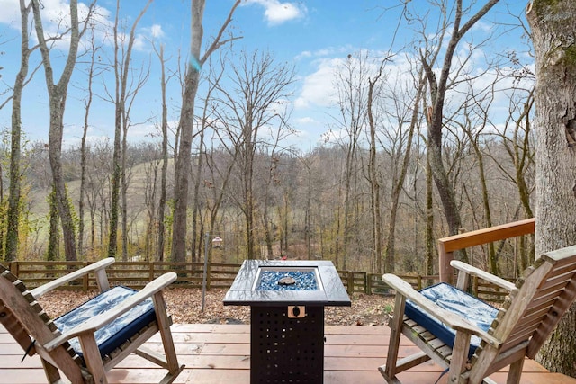 wooden deck with an outdoor fire pit