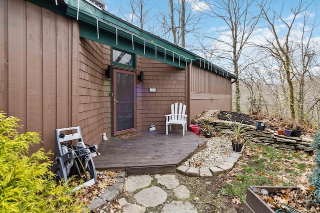 property entrance with a deck