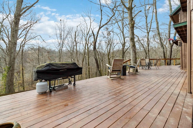 wooden terrace with area for grilling