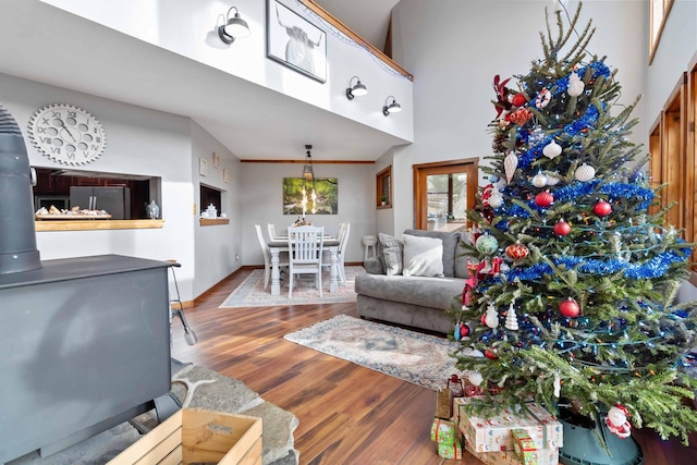 living room featuring a high ceiling and hardwood / wood-style flooring