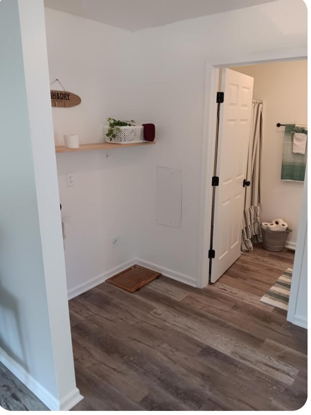 hallway with dark hardwood / wood-style floors