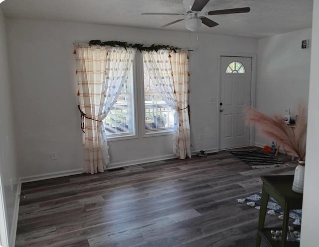 entrance foyer with dark hardwood / wood-style floors and ceiling fan